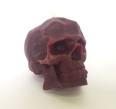 Свеча восковая череп пурпурная средняя %% внешний вид
